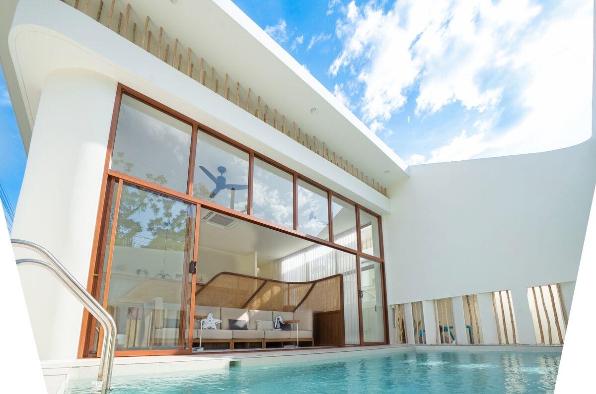 Private pool and villa at SandScape in the evening light