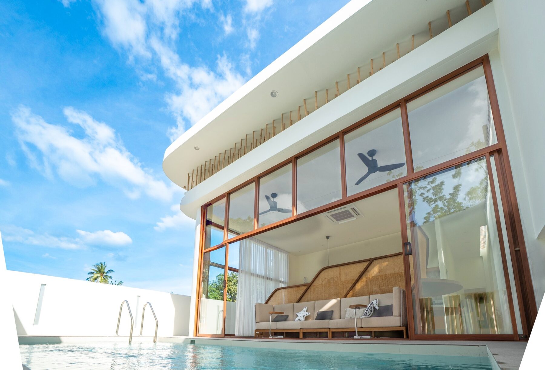 Infinity pool overlooking the clear sea at SandScape, Sam Roi Yot at sunset